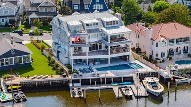Welcome to 55 Walnut Road, a stunning bayfront masterpiece. This