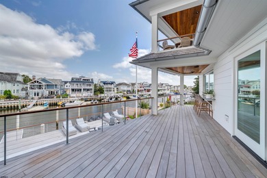 Welcome to 55 Walnut Road, a stunning bayfront masterpiece. This