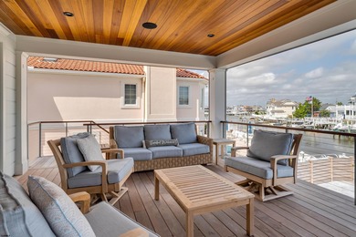 Welcome to 55 Walnut Road, a stunning bayfront masterpiece. This