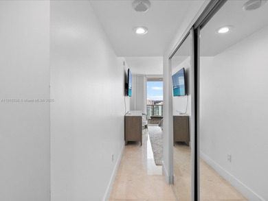 Commanding the skyline of Aventura, this Peninsula II penthouse