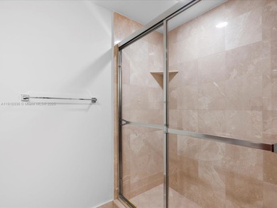 Commanding the skyline of Aventura, this Peninsula II penthouse