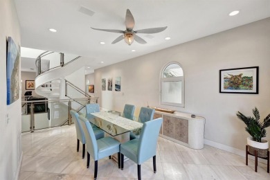 Newly priced! This gorgeous three level townhome located in an