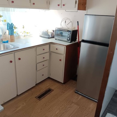 Move right in and enjoy this updated home in 55+ Community! Home