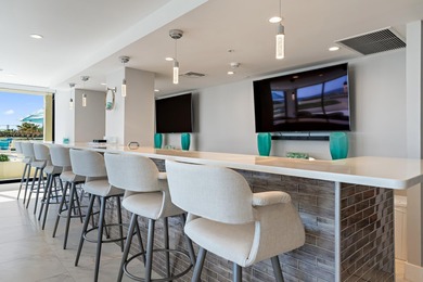 This renovated 2-bedroom, 2-bath ocean-facing corner residence