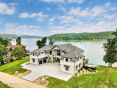 This magnificent lake home offers 6+ bedrooms, 8 full baths, 5