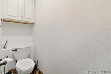 Discover lakeside living at its finest in this beautifully