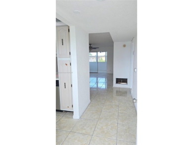 This top-floor unit in the highly sought-after *T* building