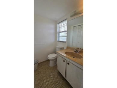 This top-floor unit in the highly sought-after *T* building