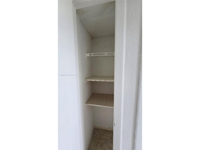 This top-floor unit in the highly sought-after *T* building