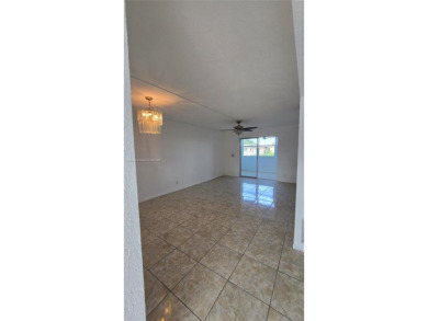 This top-floor unit in the highly sought-after *T* building