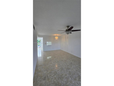 This top-floor unit in the highly sought-after *T* building