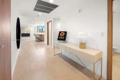 Step into this stunning corner unit at Onda, Bay Harbor's