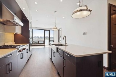 Experience luxury waterfront living in this stunning 2-bedroom