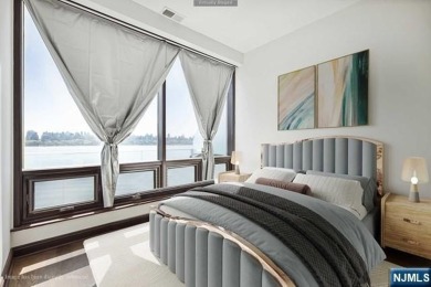 Experience luxury waterfront living in this stunning 2-bedroom