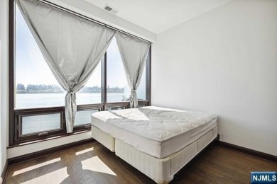 Experience luxury waterfront living in this stunning 2-bedroom