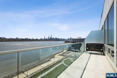 Experience luxury waterfront living in this stunning 2-bedroom