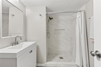 Welcome to this charming ground-floor 2-bed, 2-bath condo in the