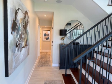 This exquisite custom waterfront residence features four