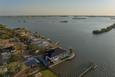 Set on a corner lot with over 200 feet of waterfront, this