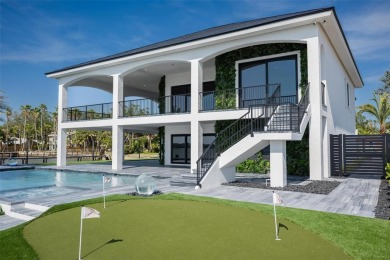 Set on a corner lot with over 200 feet of waterfront, this