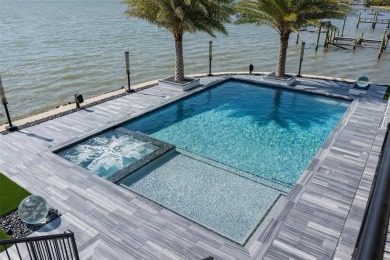 Set on a corner lot with over 200 feet of waterfront, this