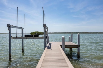 Set on a corner lot with over 200 feet of waterfront, this
