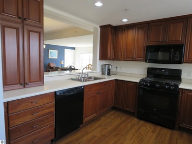 This charming condo offers stunning, expansive views of Lake