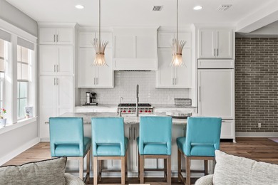 Located within the gated community of Kelly Plantation, The