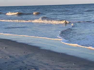 Discover beachside living at its finest with this beautifully