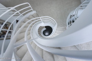 This striking three story, 7000+ square foot residence is