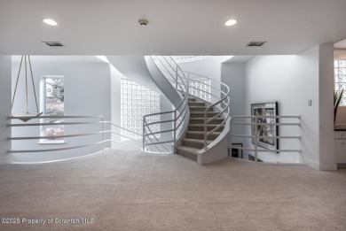 This striking three story, 7000+ square foot residence is