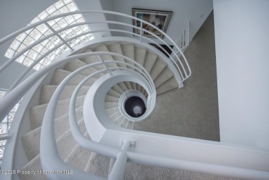 This striking three story, 7000+ square foot residence is