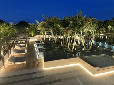 Experience Boca's Beauty from this Lanai Residence with a