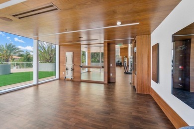 Experience Boca's Beauty from this Lanai Residence with a