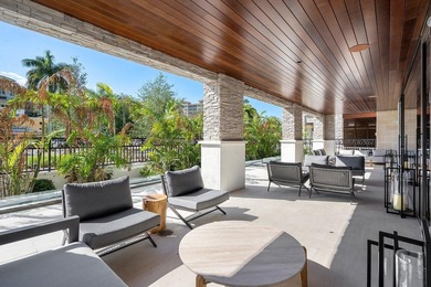 Experience Boca's Beauty from this Lanai Residence with a