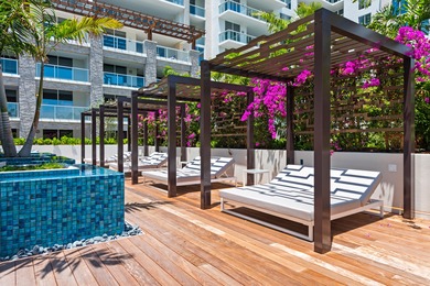 Experience Boca's Beauty from this Lanai Residence with a