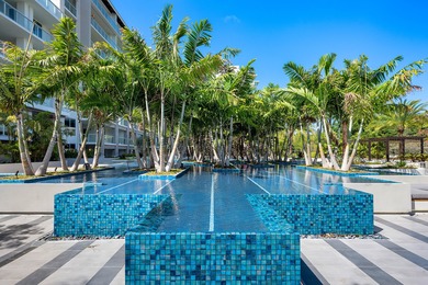 Experience Boca's Beauty from this Lanai Residence with a