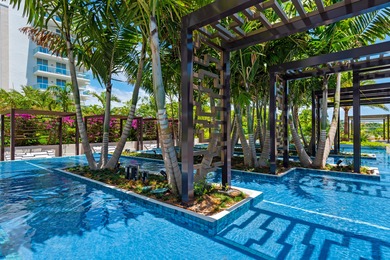 Experience Boca's Beauty from this Lanai Residence with a