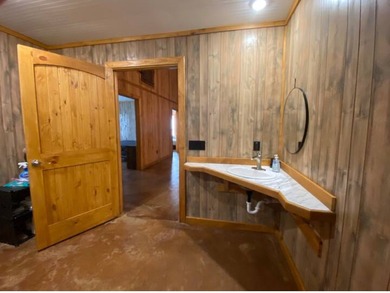 Enjoy lake living at its best in this spacious 4-bedroom, 2-bath