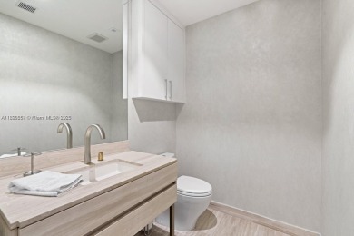 This extraordinary corner unit with unobstructed views,  Armani