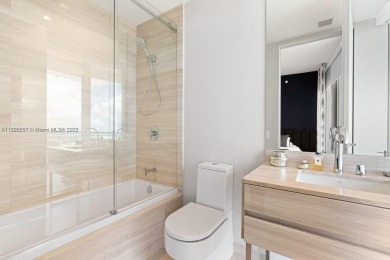 This extraordinary corner unit with unobstructed views,  Armani