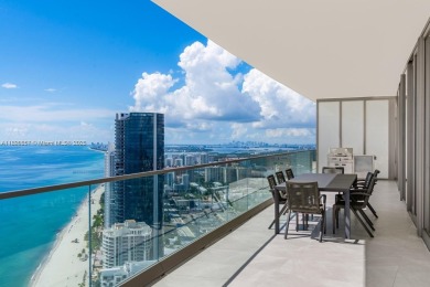 This extraordinary corner unit with unobstructed views,  Armani