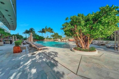 This extraordinary corner unit with unobstructed views,  Armani