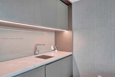 This extraordinary corner unit with unobstructed views,  Armani