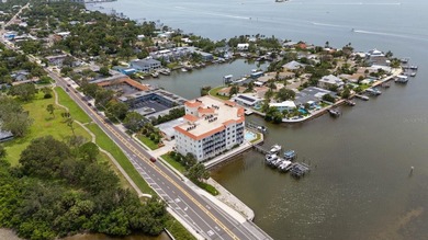 3 BEDROOMS, 2.5 BATHS, LARGE 2 CAR GARAGE AND A BOAT SLIP!