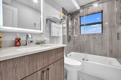 Impeccably renovated corner condo showcasing exceptional luxury