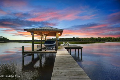 Embrace upscale, waterside living in this stunning two-story, 5