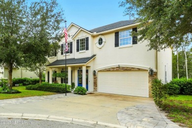 Embrace upscale, waterside living in this stunning two-story, 5