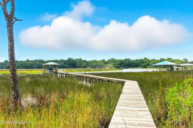 Embrace upscale, waterside living in this stunning two-story, 5