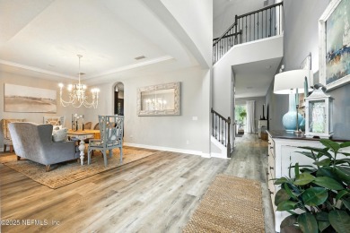 Embrace upscale, waterside living in this stunning two-story, 5